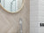 Herringbone and subway wall tile in a bathroom