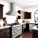 ZLINE 36 in. Designer Series Ducted Wall Mount Range Hood in Satin Stainless Steel (8656S-36) in a luxury kitchen.
