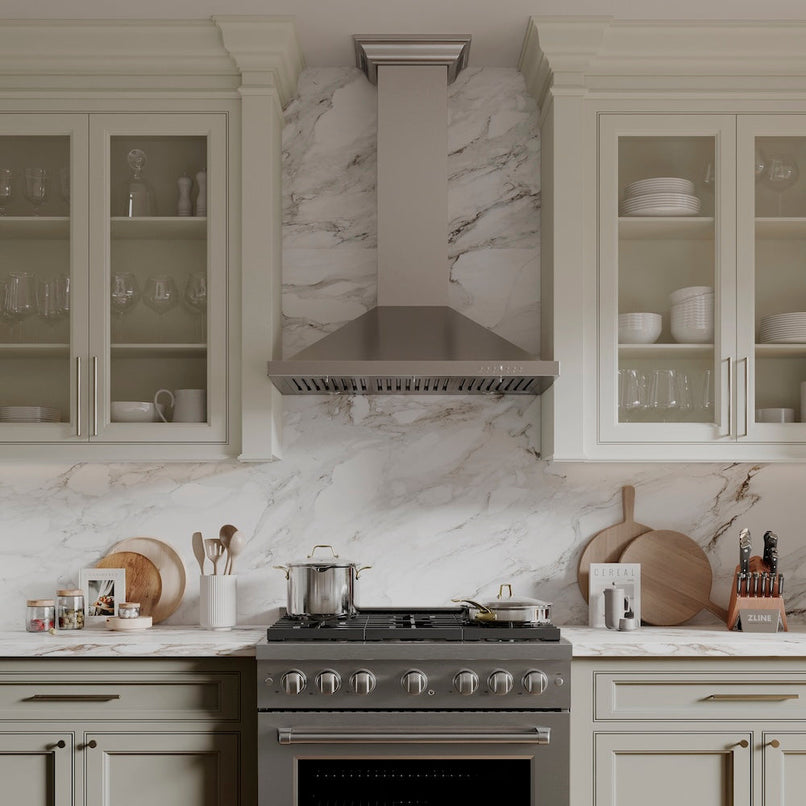 ZLINE 36 in. Convertible Vent Wall Mount Range Hood in Stainless Steel with Crown Molding (KBCRN-36) in a luxury kitchen.