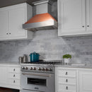 ZLINE 30 in. Ducted Satin Stainless Steel Wall Mount Range Hood with Copper Shell (8654C-30) in a luxury kitchen.