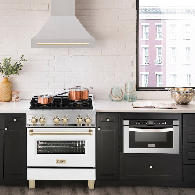 ZLINE Autograph Edition 30 in. Satin Stainless Steel Wall Mount Range Hood with Polished Gold Handle (8654SNZ-30-G) in a luxury kitchen.