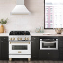 ZLINE Autograph Edition 30 in. Satin Stainless Steel Wall Mount Range Hood with White Matte Shell and Champagne Bronze Handle (8654SNZ-WM30-CB) in a luxury kitchen.