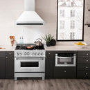 ZLINE Autograph Edition 36 in. Satin Stainless Steel Wall Mount Range Hood with White Matte Shell and Matte Black Handle (8654SNZ-WM36-MB) in a luxury kitchen.