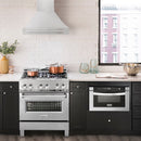 ZLINE 30 in. Satin Stainless Steel Wall Mount Range Hood with Stainless Steel Handle (8654SNX-30) in a luxury kitchen.