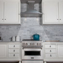 ZLINE 48 in. Designer Series Satin Stainless Steel Convertible Vent Wall Mount Range Hood (8KBS-48) in a luxury kitchen.