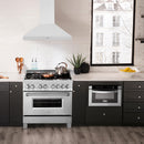 ZLINE 36 in. Convertible Vent Wall Mount Range Hood in Satin Stainless Steel (8KL3S-36) in a luxury kitchen.