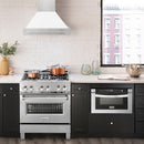 ZLINE 30 in. Satin Stainless Steel Wall Mount Range Hood with White Matte Shell and Stainless Steel Handle (8654SNX-WM-30) in a luxury kitchen.