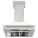 ZLINE Autograph Edition 36 in. Stainless Steel Range Hood with White Matte Shell and Polished Gold Handle (8654STZ-WM36-G) front, under.